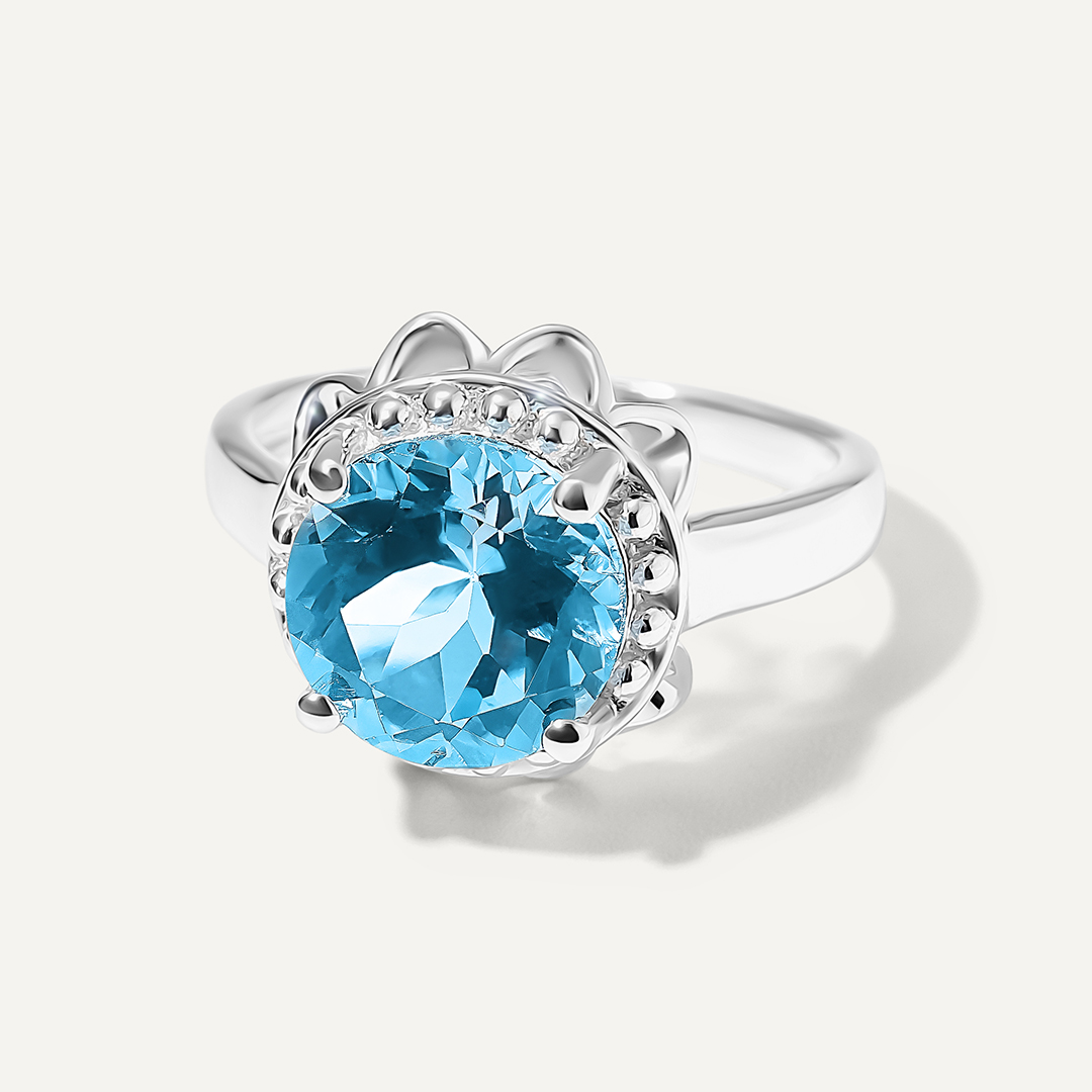 Серебряное кольцо с топазом Скай "Цветок"