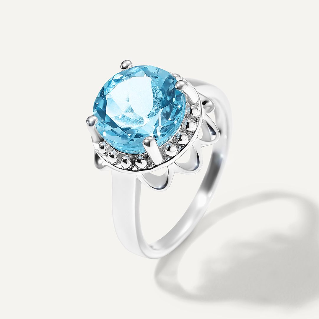Серебряное кольцо с топазом Скай "Цветок"