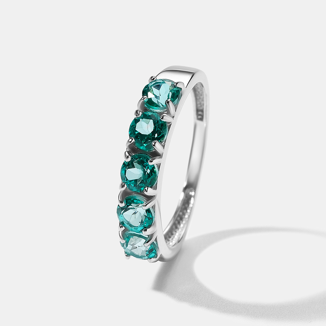 Серебряное кольцо с зелеными топазами