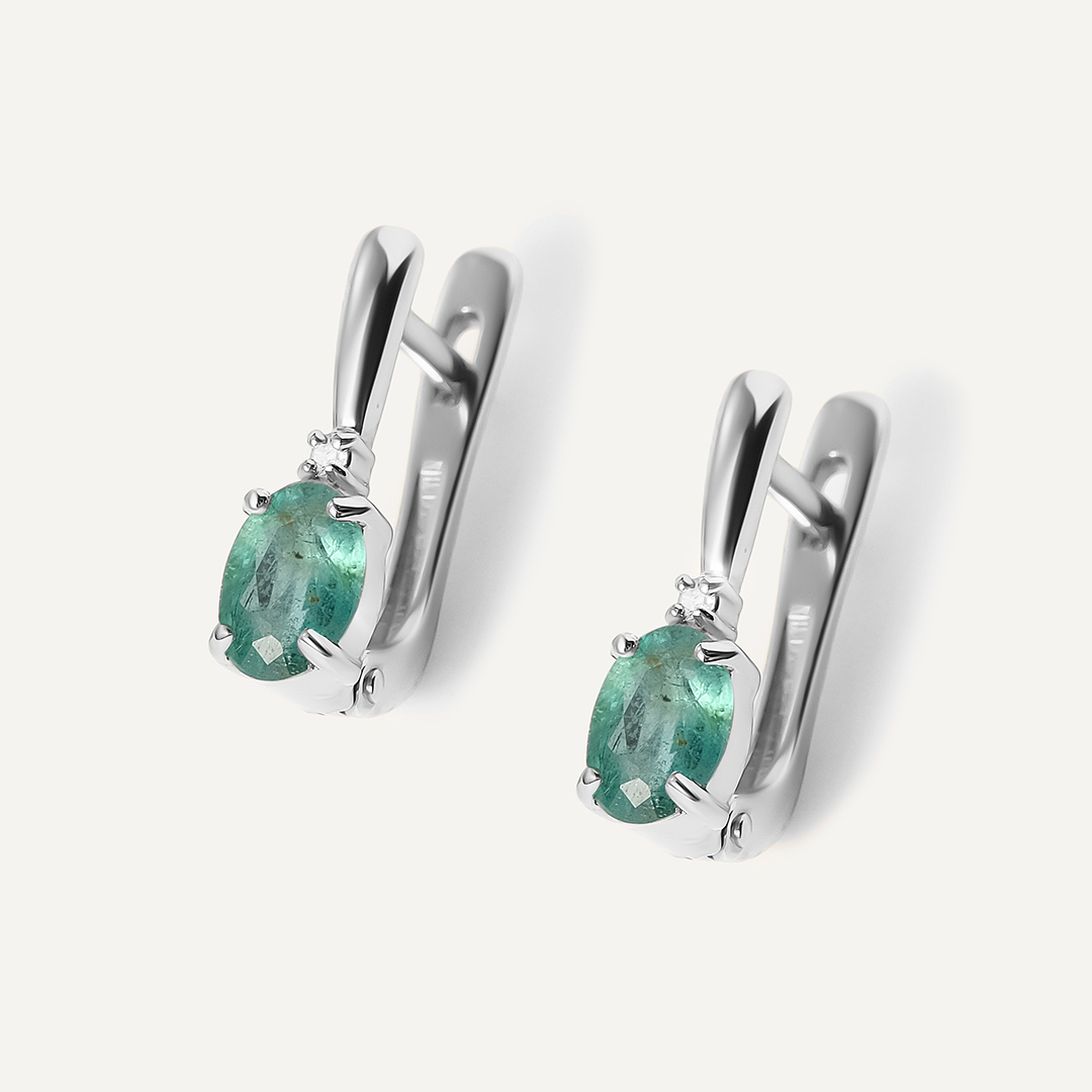 Серьги из белого золота с изумрудами