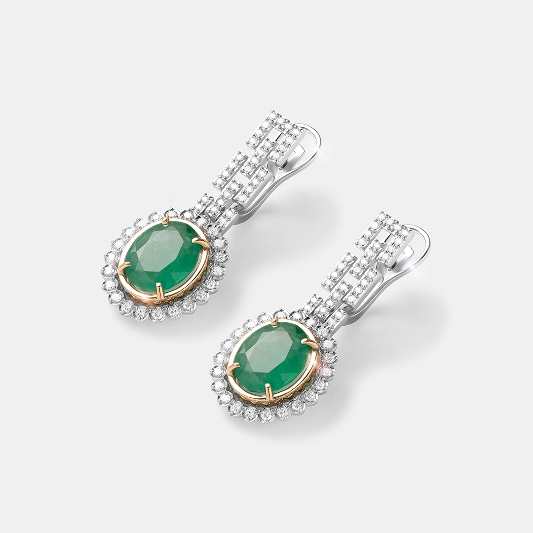 Серьги из комбинированного золота с изумрудами