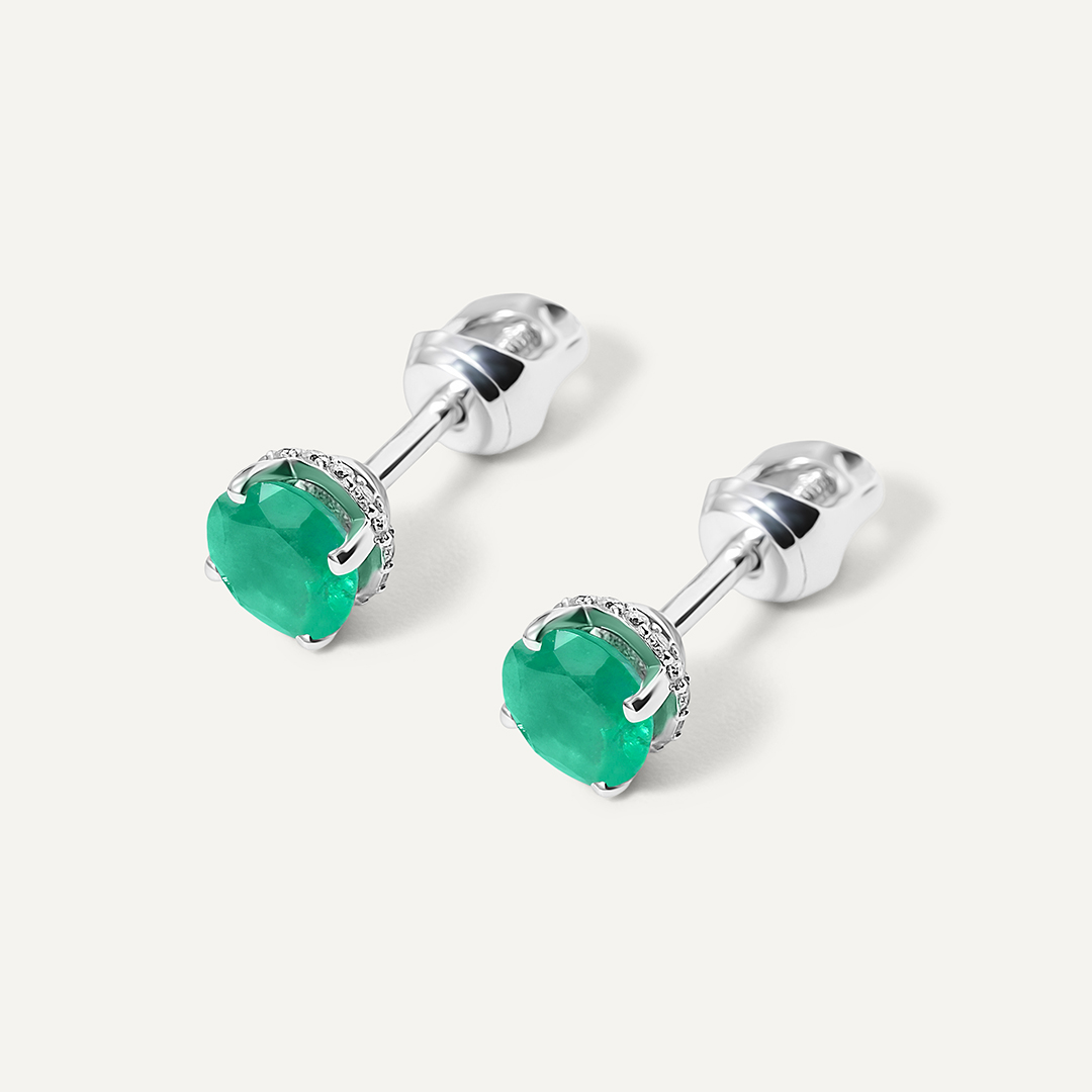 Серьги из белого золота с изумрудами