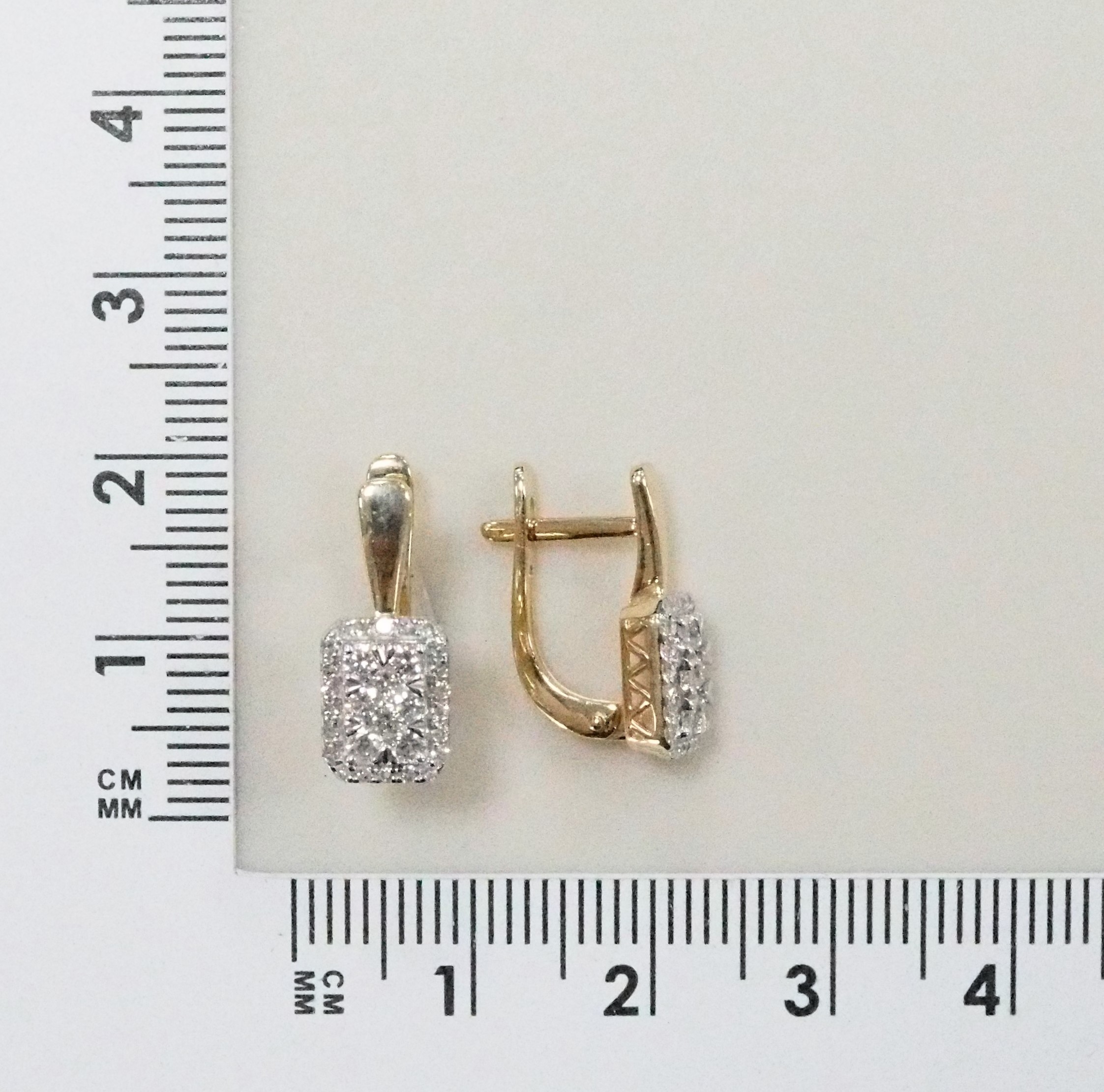 Золотые серьги 585 пробы; родий; вставки 12 Бр.Кр-57 0,364 3/6А; 4 Бр.Кр-57 0,086 3/6А; 44 Бр.Кр-17