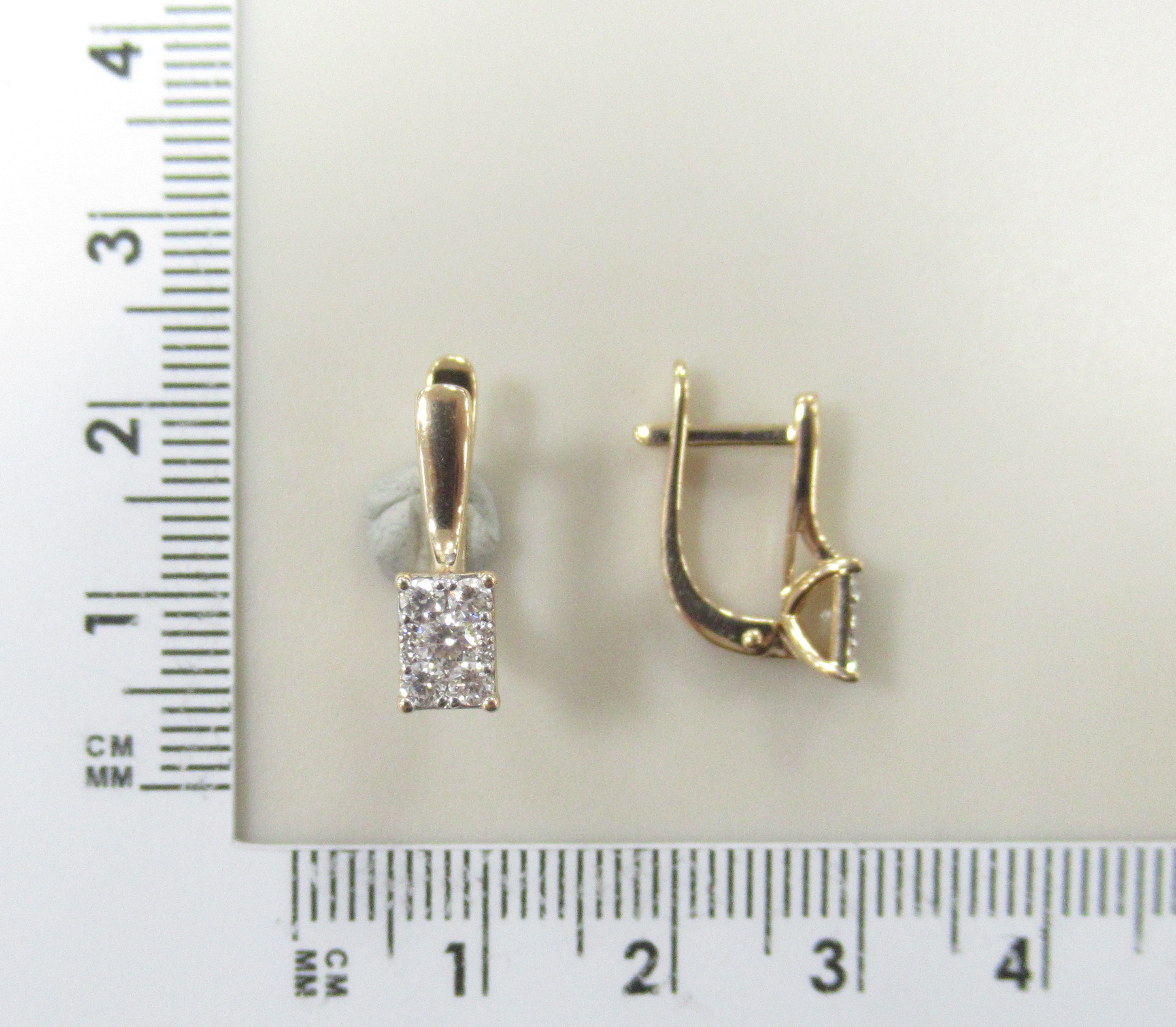 Золотые серьги 585 пробы; родий; вставки 12 Бр.Кр-57 0,061 3/6А; 80 Бр.Кр-57 0,218 3/6А; 4 Бр.Бп 0,1